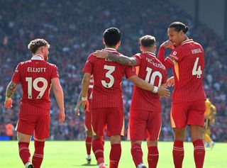 Alexis Mac Allister of Liverpool celebrates after scoring the opening goal during the Premier League match between Liverpool FC and Wolverhampton Wanderers at Anfield on May 19, 2024 in Liverpool, England.