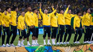 Brazil players celebrate with the gold medals after winning the men's football tournament at the Rio de Janeiro Olympics in 2016.